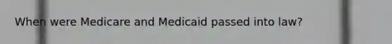 When were Medicare and Medicaid passed into law?