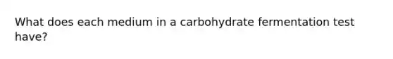 What does each medium in a carbohydrate fermentation test have?