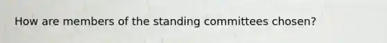 How are members of the standing committees chosen?