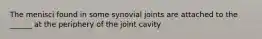 The menisci found in some synovial joints are attached to the ______ at the periphery of the joint cavity