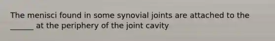 The menisci found in some synovial joints are attached to the ______ at the periphery of the joint cavity