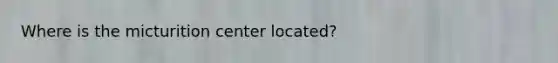 Where is the micturition center located?