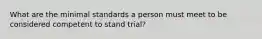 What are the minimal standards a person must meet to be considered competent to stand trial?