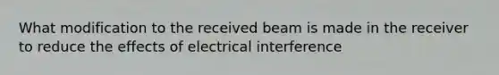 What modification to the received beam is made in the receiver to reduce the effects of electrical interference