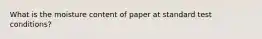 What is the moisture content of paper at standard test conditions?