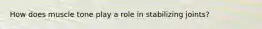 How does muscle tone play a role in stabilizing joints?