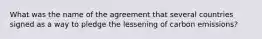 What was the name of the agreement that several countries signed as a way to pledge the lessening of carbon emissions?