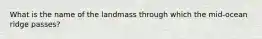 What is the name of the landmass through which the mid-ocean ridge passes?