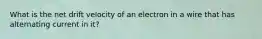 What is the net drift velocity of an electron in a wire that has alternating current in it?