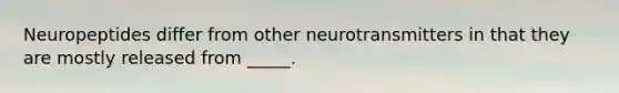 Neuropeptides differ from other neurotransmitters in that they are mostly released from _____.