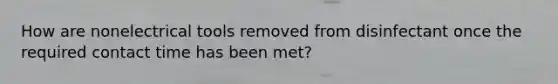How are nonelectrical tools removed from disinfectant once the required contact time has been met?