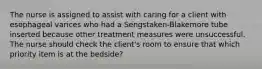 The nurse is assigned to assist with caring for a client with esophageal varices who had a Sengstaken-Blakemore tube inserted because other treatment measures were unsuccessful. The nurse should check the client's room to ensure that which priority item is at the bedside?