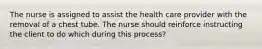 The nurse is assigned to assist the health care provider with the removal of a chest tube. The nurse should reinforce instructing the client to do which during this process?