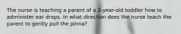 The nurse is teaching a parent of a 2-year-old toddler how to administer ear drops. In what direction does the nurse teach the parent to gently pull the pinna?