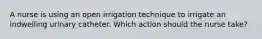 A nurse is using an open irrigation technique to irrigate an indwelling urinary catheter. Which action should the nurse take?