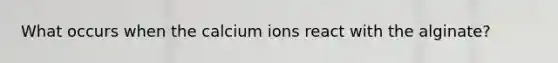 What occurs when the calcium ions react with the alginate?