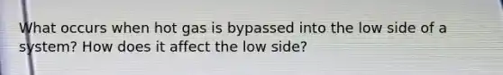 What occurs when hot gas is bypassed into the low side of a system? How does it affect the low side?