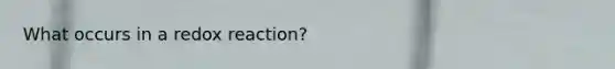 What occurs in a redox reaction?