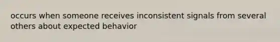 occurs when someone receives inconsistent signals from several others about expected behavior