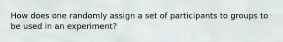 How does one randomly assign a set of participants to groups to be used in an experiment?