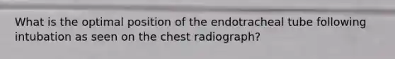 What is the optimal position of the endotracheal tube following intubation as seen on the chest radiograph?