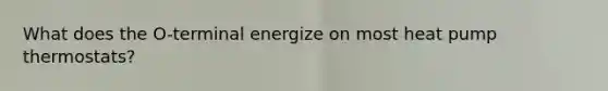 What does the O-terminal energize on most heat pump thermostats?