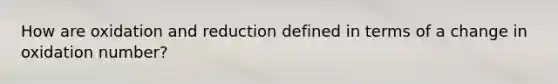 How are oxidation and reduction defined in terms of a change in oxidation number?