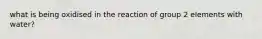 what is being oxidised in the reaction of group 2 elements with water?