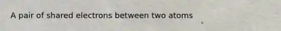 A pair of shared electrons between two atoms