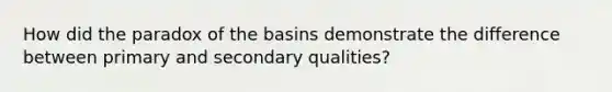 How did the paradox of the basins demonstrate the difference between primary and secondary qualities?