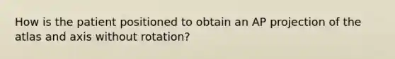 How is the patient positioned to obtain an AP projection of the atlas and axis without rotation?