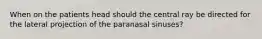 When on the patients head should the central ray be directed for the lateral projection of the paranasal sinuses?