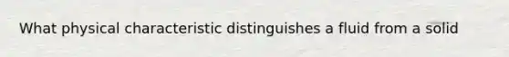 What physical characteristic distinguishes a fluid from a solid