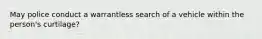 May police conduct a warrantless search of a vehicle within the person's curtilage?