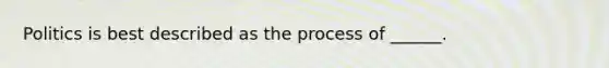 Politics is best described as the process of ______.