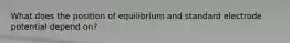 What does the position of equilibrium and standard electrode potential depend on?