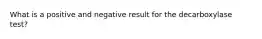 What is a positive and negative result for the decarboxylase test?