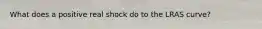 What does a positive real shock do to the LRAS curve?
