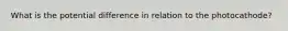 What is the potential difference in relation to the photocathode?