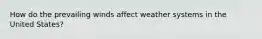 How do the prevailing winds affect weather systems in the United States?