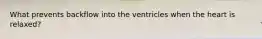 What prevents backflow into the ventricles when the heart is relaxed?