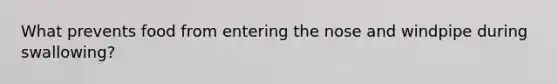 What prevents food from entering the nose and windpipe during swallowing?
