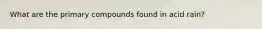 What are the primary compounds found in acid rain?