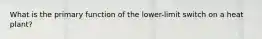 What is the primary function of the lower-limit switch on a heat plant?