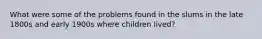 What were some of the problems found in the slums in the late 1800s and early 1900s where children lived?