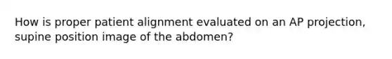 How is proper patient alignment evaluated on an AP projection, supine position image of the abdomen?