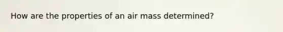 How are the properties of an air mass determined?