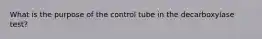 What is the purpose of the control tube in the decarboxylase test?