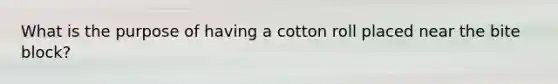 What is the purpose of having a cotton roll placed near the bite block?