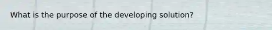 What is the purpose of the developing solution?